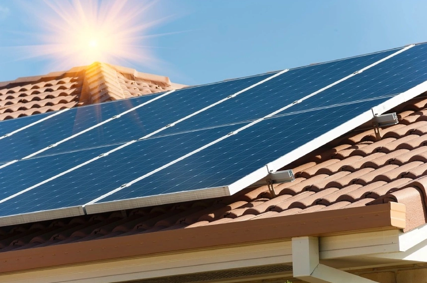 A solar panel on the roof of a house.