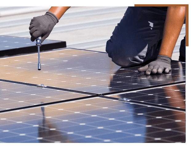 A person is working on solar panels.